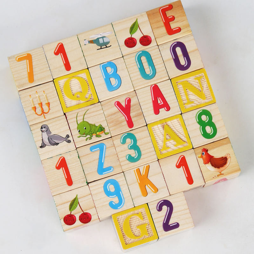 Close-up of wooden learning blocks with colourful letters, numbers and animal pictures