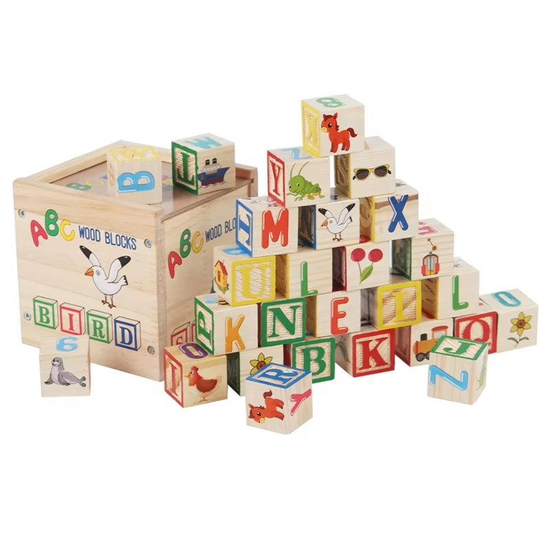 Illustrated wooden learning blocks arranged beside their wooden storage box